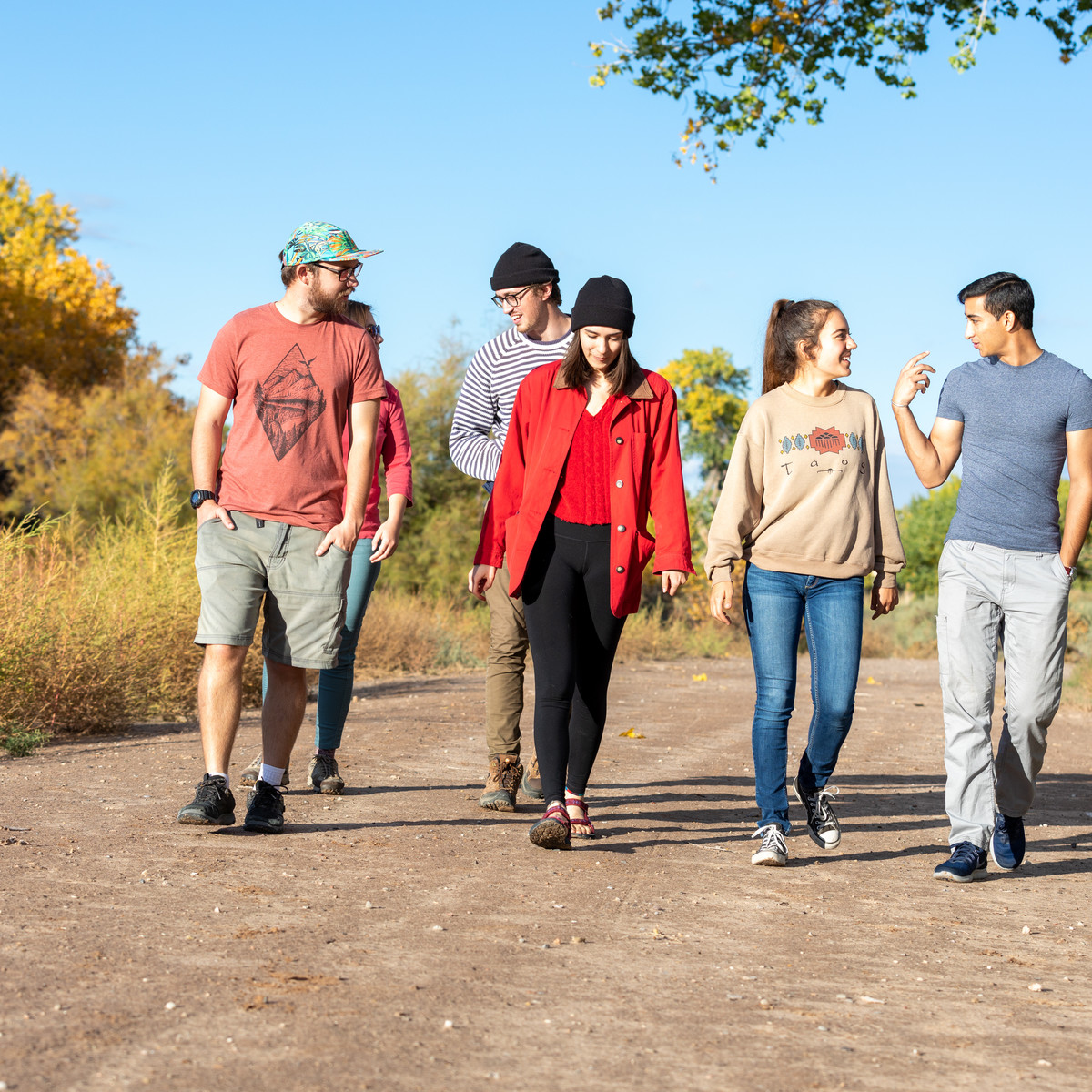 Group of students walking together on a trail
